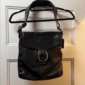 Coach Black Leather Shoulder Bag with adjustable strap.